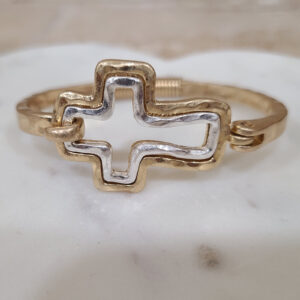 Donna Fargo Favorite Open Cross Bracelet featuring a gold-tone finish with a silver-tone inlay and an easy hook clasp.