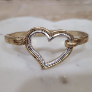 Donna Fargo Favorite Open Heart Bracelet featuring a gold-tone finish with a silver-tone inlay and an easy hook clasp.