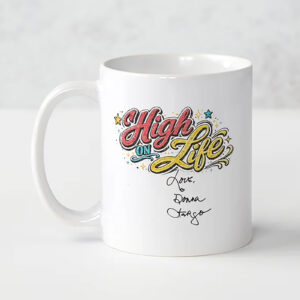 White ceramic coffee mug featuring Donna Fargo's colorful "High on Life" design, inspired by her message of choosing happiness, gratitude, and a positive outlook on life.