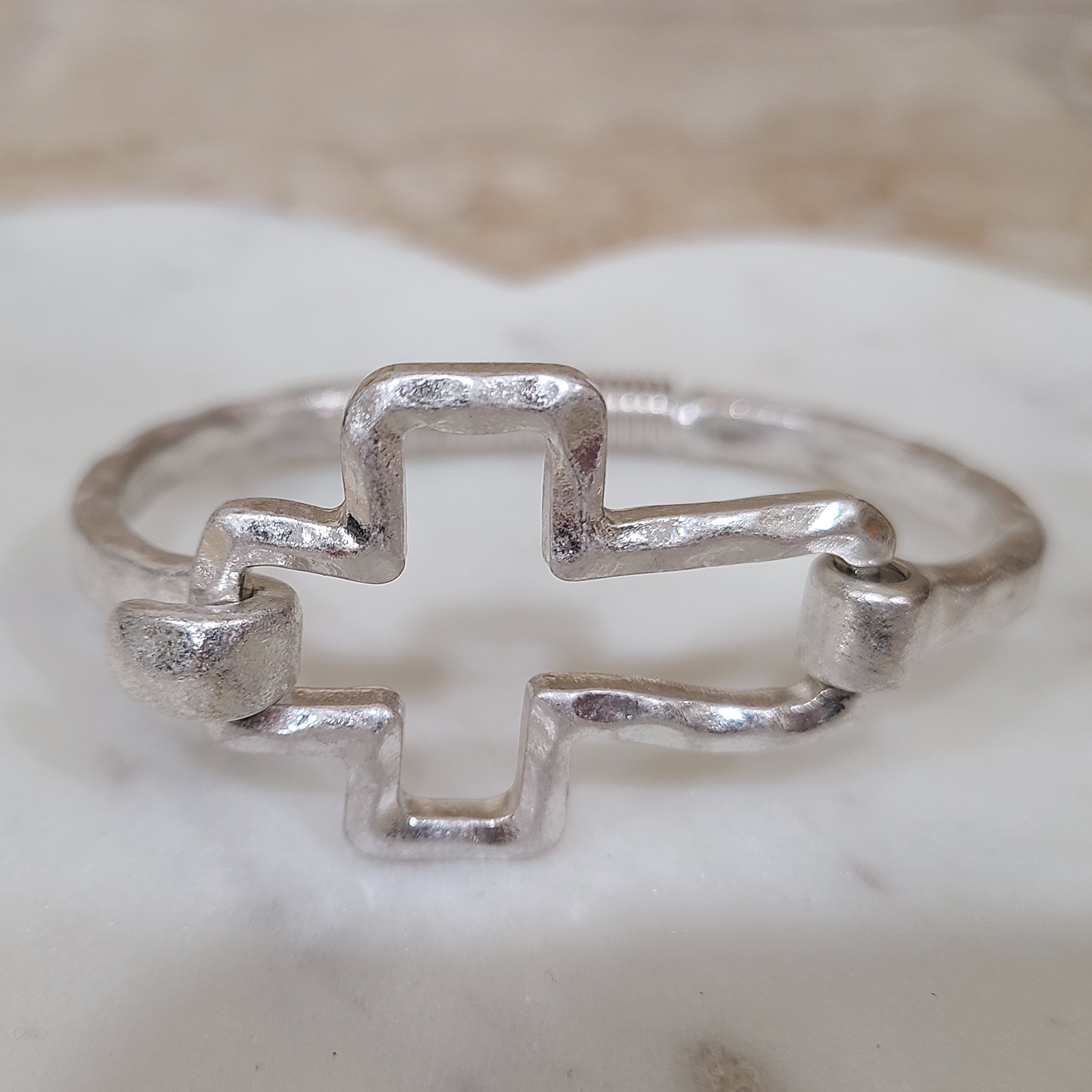 Donna Fargo Favorite Open Cross Bracelet featuring a silver-tone finish and an easy hook clasp.
