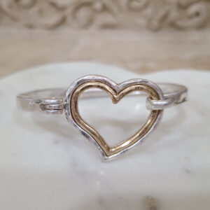 Donna Fargo Favorite Open Heart Bracelet featuring a silver-tone finish with a gold-tone inlay and an easy hook clasp.